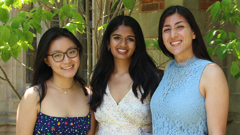 Three female Yale students smiling for a photo