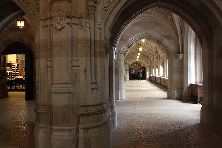 View looking from Sterling nave down long stone corridor with arched ceiling and light coming through windows along the lefthand side.
