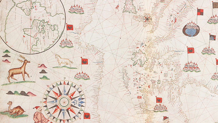 Detail of sixteenth-century map on parchment, showing drawings of reindeer, camel, unicorn at left, a sixteen-point blue, black, and red compass rose at lower edge and drawing of a coastline with handwritten notations, clusters of buildings with red and black flags throughout and an inset circle showing Europe, Africa, the Atlantic and the coast of the New World
