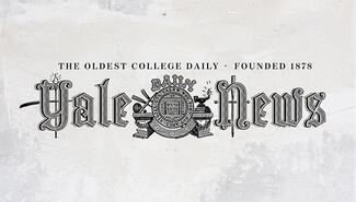Logo of "Yale Daily News" in shaded Gothic script, at center below the word "Daily" is a wound medallion with two balls, a baseball bat, and two oars to the left and a lit lantern to the right. Text above  reads "The oldest college daily, founded 1878"
