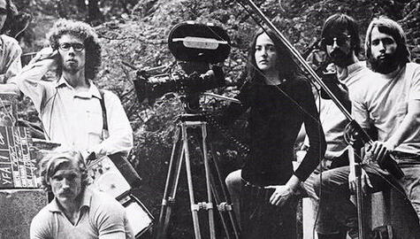 Black and white photo of Yale filmmakers standing around a movie camera mounted on a tripod