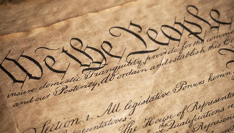 A photo of the U.S. Constitution with the words "We the people."