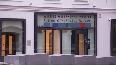 An entrance with a sign reading WIENER WIESENTHAL INSTITUT FUR HOLOCAUST-STUDIEN (VWI)
