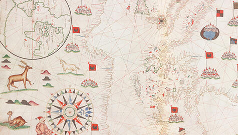 Detail of sixteenth-century map on parchment, showing drawings of reindeer, camel, unicorn at left, a sixteen-point blue, black, and red compass rose at lower edge and drawing of a coastline with handwritten notations, clusters of buildings with red and black flags throughout and an inset circle showing Europe, Africa, the Atlantic and the coast of the New World